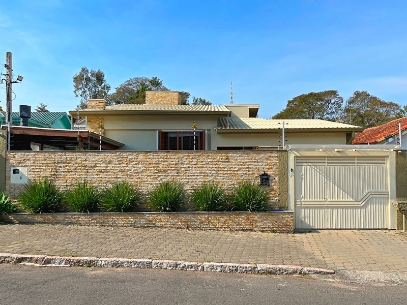 Casa à venda com 120m², 4 quartos, 2 vagas no bairro Santa Tereza em Porto Alegre