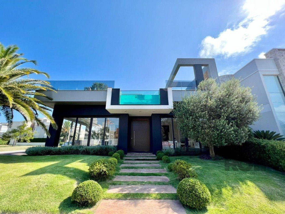 Casa de Condomínio 4 dormitórios no bairro Arroio Teixeira