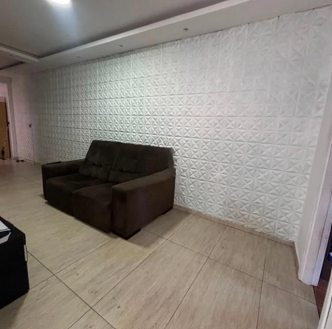 Casa de dois dormitórios com  02 suítes e 01 vaga de garagem