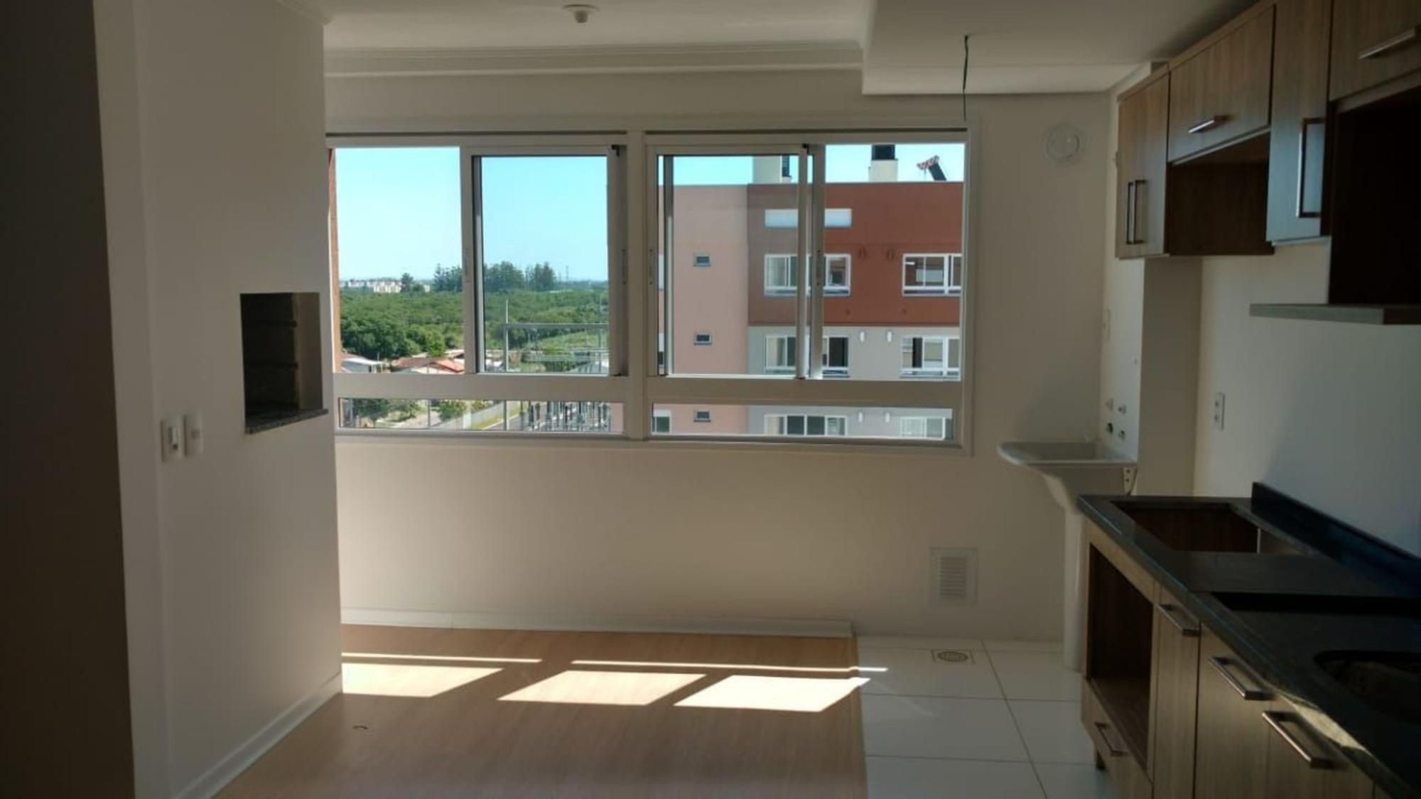 Apartamento de 2 dormitórios, elevador e 1 vaga de garagem.