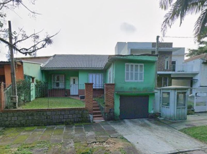 Casa no bairro Jardim Botânico de 3 dormitórios e garagem
